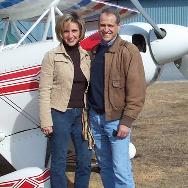 Bud and Terri Allen in front of their Pitts S2A biplane, N80003